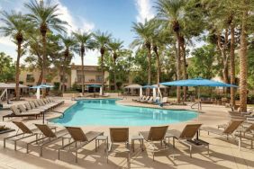 Stunning outdoor pool with sun beds at Hilton Scottsdale Resort & Villas.