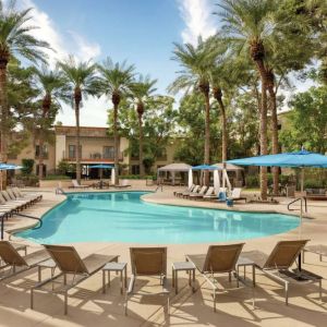 Stunning outdoor pool with sun beds at Hilton Scottsdale Resort & Villas.