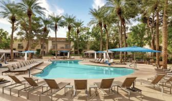 Stunning outdoor pool with sun beds at Hilton Scottsdale Resort & Villas.