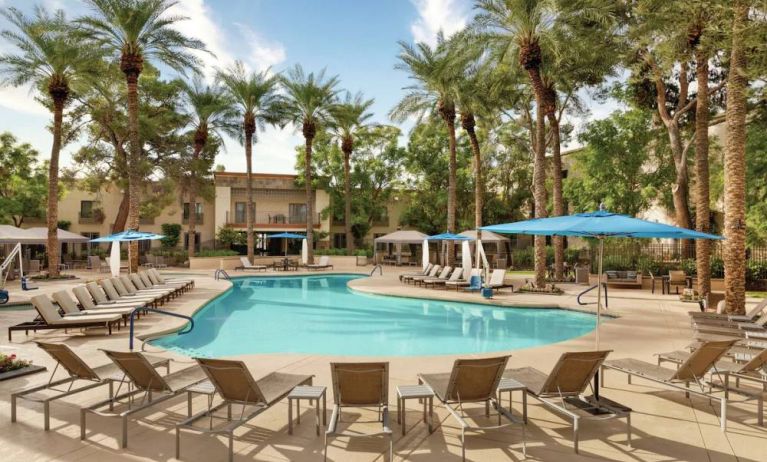 Stunning outdoor pool with sun beds at Hilton Scottsdale Resort & Villas.