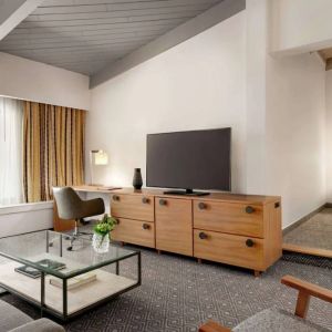 Day use room with TV and lounge area at Hilton Scottsdale Resort & Villas.