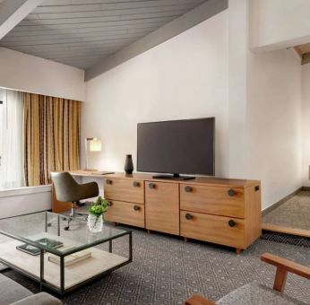 Day use room with TV and lounge area at Hilton Scottsdale Resort & Villas.