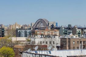 Rooftop terrace with city view at Astoria Inn LaGuardia Hotel.