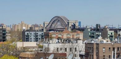 Rooftop terrace with city view at Astoria Inn LaGuardia Hotel.