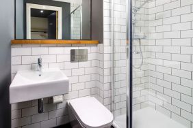 Guest bathroom with shower at Ibis Budget Sheffield Centre St Marys Gate.