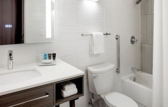 Guest bathroom with shower and bath combo at Crowne Plaza Atlanta-Midtown.