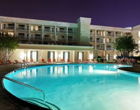Stunning outdoor pool with pool loungers at Holiday Inn Express Atlanta Airport - North.