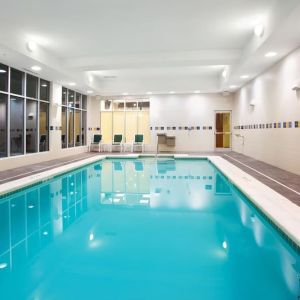 Relaxing indoor pool with seating area at Holiday Inn Aurora North- Naperville.