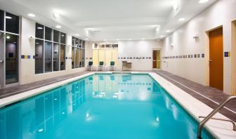 Relaxing indoor pool with seating area at Holiday Inn Aurora North- Naperville.