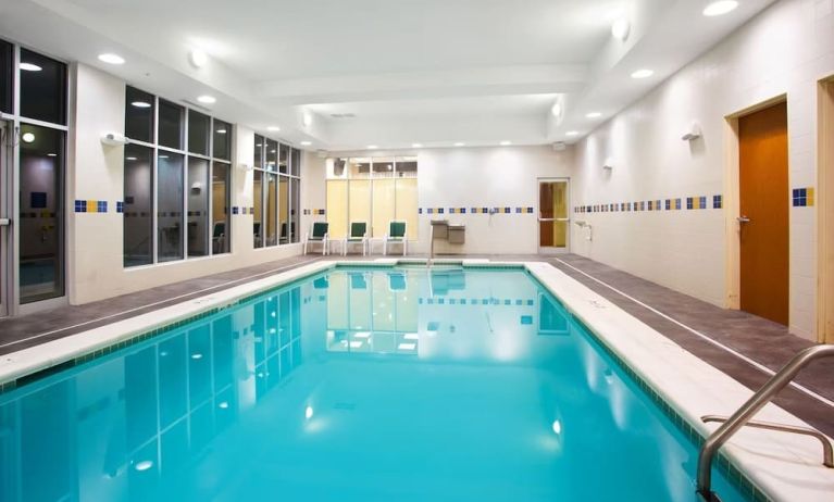 Relaxing indoor pool with seating area at Holiday Inn Aurora North- Naperville.