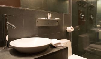 Guest bathroom with shower at Hotel Chelsea, A South Beach Group Hotel.