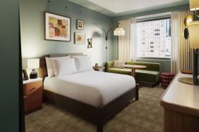 Deluxe king room with natural light at Romer Hell's Kitchen.