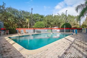 Relaxing outdoor pool at OYO Townhouse Orlando West.