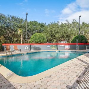 Relaxing outdoor pool at OYO Townhouse Orlando West.