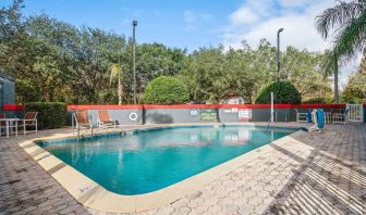 Relaxing outdoor pool at OYO Townhouse Orlando West.