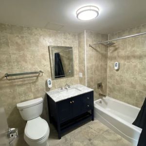 Private bathroom with shower at Hotel Liberty Inn & Suites.