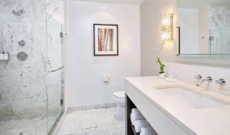 Bathroom with shower at Ko'a Kea Resort On Po`ipu Beach.