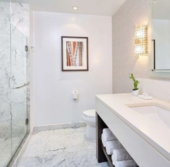 Bathroom with shower at Ko'a Kea Resort On Po`ipu Beach.