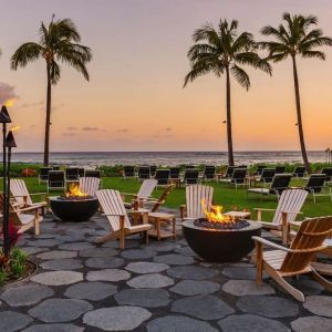 Garden with seating area ideal for coworking at Ko'a Kea Resort On Po`ipu Beach.