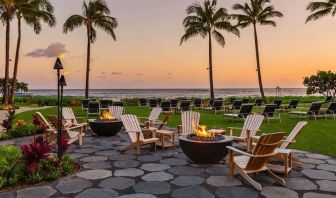 Garden with seating area ideal for coworking at Ko'a Kea Resort On Po`ipu Beach.