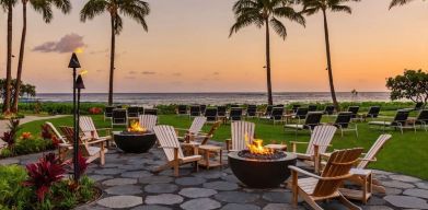 Garden with seating area ideal for coworking at Ko'a Kea Resort On Po`ipu Beach.