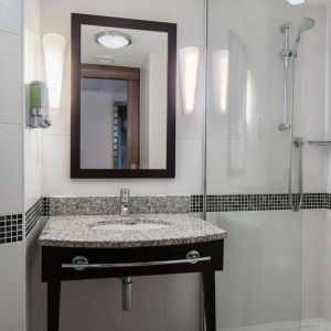 Guest bathroom with shower at Hampton By Hilton Birmingham Broad Street.