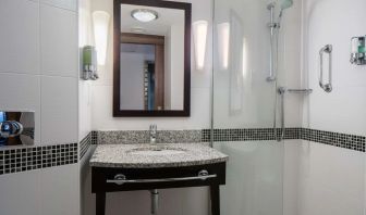 Guest bathroom with shower at Hampton By Hilton Birmingham Broad Street.