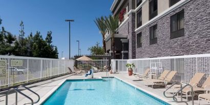 Refreshing outdoor pool at Hampton Inn Los Angeles-Orange County-Cypress.