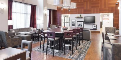 Dining area perfect for coworking at Hampton Inn Los Angeles-Orange County-Cypress.