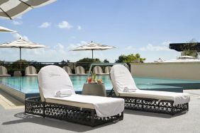 Stunning outdoor pool with sun beds at THesis Hotel Miami.