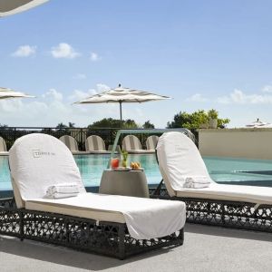 Stunning outdoor pool with sun beds at THesis Hotel Miami.