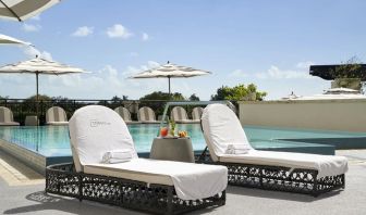 Stunning outdoor pool with sun beds at THesis Hotel Miami.