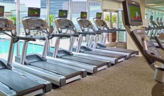 The hotel fitness center has numerous treadmills and other exercise machines, and faces the pool.