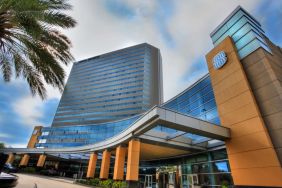 Royal Sonesta Houston Galleria’s parking area is by the hotel’s covered entranceway, which features plenty of potted plants.