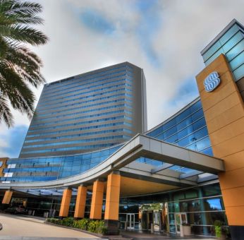 Royal Sonesta Houston Galleria’s parking area is by the hotel’s covered entranceway, which features plenty of potted plants.