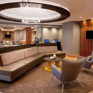 Co-working space is available in the lobby lounge, which features a sofa and pair of stylish chairs, plus a coffee table and TV.