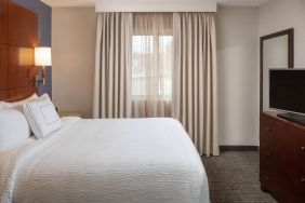 Sonesta ES Suites Nashville Brentwood guest room, featuring deluxe king bed, TV, and window.