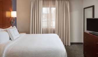 Sonesta ES Suites Nashville Brentwood guest room, featuring deluxe king bed, TV, and window.