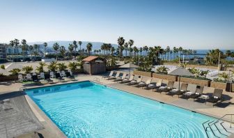 Stunning outdoor pool area with pool chairs at Sonesta Redondo Beach & Marina.