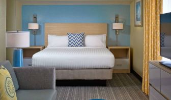 Double bed guest room in Sonesta ES Suites Cincinnati - Blue Ash, including sofa, window, and TV.