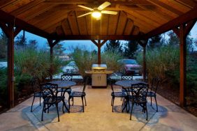 Sonesta Simply Suites Cleveland North Olmsted Airport’s gazebo has an overhead fan, barbecue, and tables and chairs.