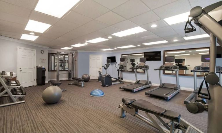 Sonesta ES Suites Dulles Airport’s fitness center is equipped with free weights, benches, and various types of exercise machine.