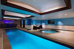 The Stephen F Austin Royal Sonesta Hotel’s narrow indoor pool has two armchairs nearby, plus a hot tub.