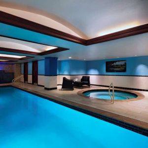 The Stephen F Austin Royal Sonesta Hotel’s narrow indoor pool has two armchairs nearby, plus a hot tub.