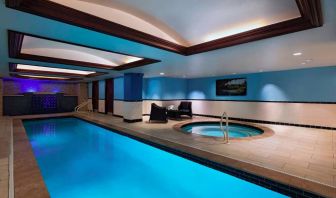 The Stephen F Austin Royal Sonesta Hotel’s narrow indoor pool has two armchairs nearby, plus a hot tub.