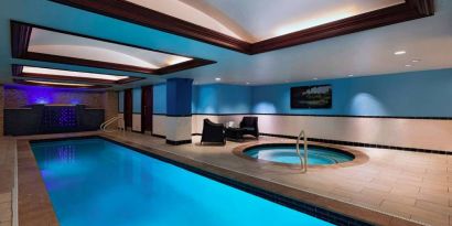 The Stephen F Austin Royal Sonesta Hotel’s narrow indoor pool has two armchairs nearby, plus a hot tub.