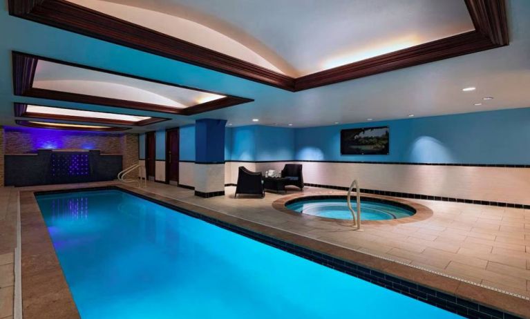 The Stephen F Austin Royal Sonesta Hotel’s narrow indoor pool has two armchairs nearby, plus a hot tub.