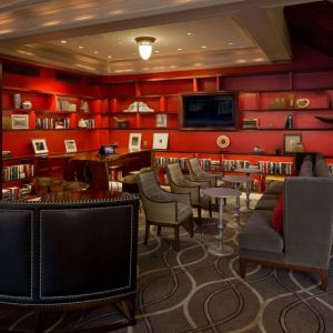 The hotel’s lobby lounge has extensive reading material, comfy chair and sofa seating, and numerous coffee tables.