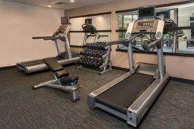 The hotel’s fitness center has racks of free weights, a bench, and treadmills for guests to use.