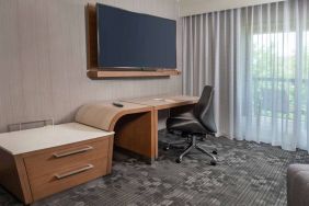 Sonesta Select Allentown Bethlehem Airport guest room workspace, including desk, chair, and huge television.